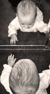 "Baby Mirror to Watch," by an unknown photographer. The Mirror Stage describes the process by which identity is formed.